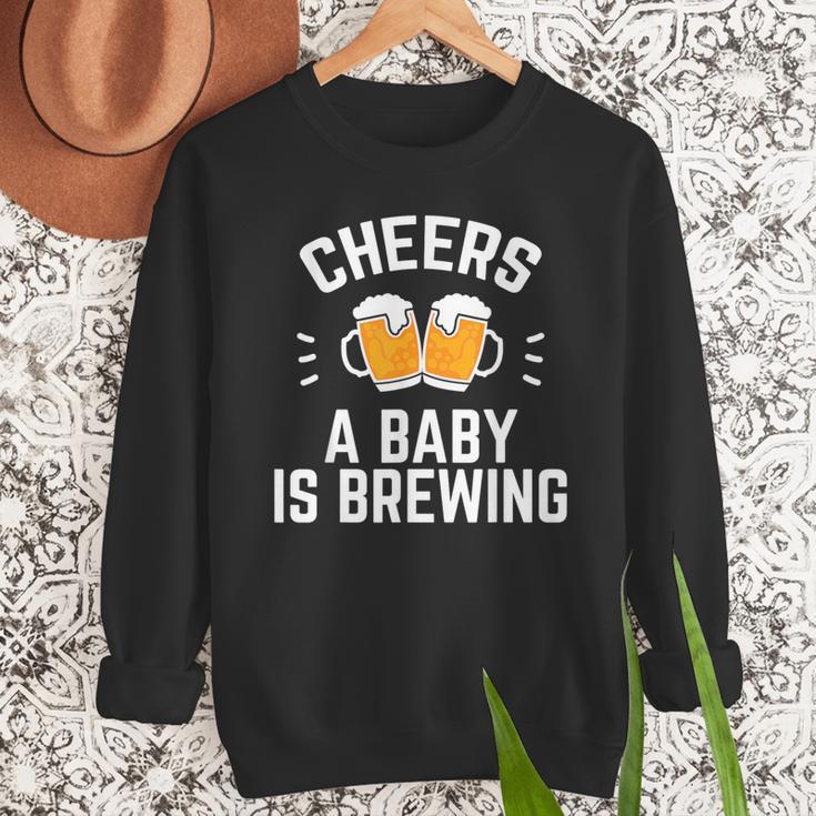New Dad Baby Shower Cheers A Baby Is Brewing Men Sweatshirt New Dad Baby Shower Cheers A Baby Is Brewing Men Sweatshirt