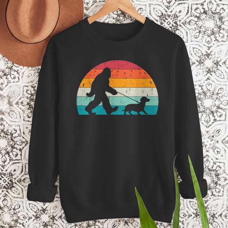 Retro Sasquatch Lover Doxie Wiener Dog Walker Bigfoot Walking a Dog Dachshund Weiner Dog Dad Weenie Small Men Sweatshirt