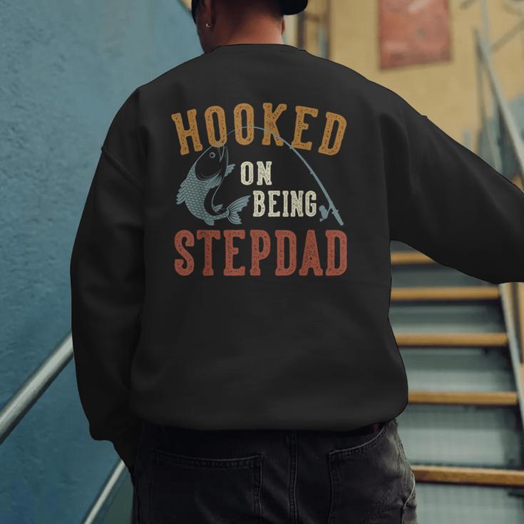 Hooked On Being Stepdad Father's Day Fishing Stepdad Men's Sweatshirt Back Print