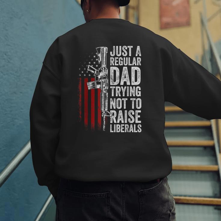 Just A Regular Dad Trying Not To Raise Liberals Father's Day Men's Sweatshirt Back Print