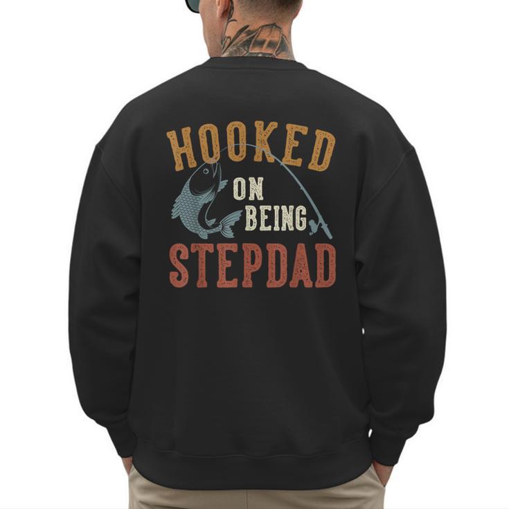Hooked On Being Stepdad Father's Day Fishing Stepdad Men's Sweatshirt Back Print