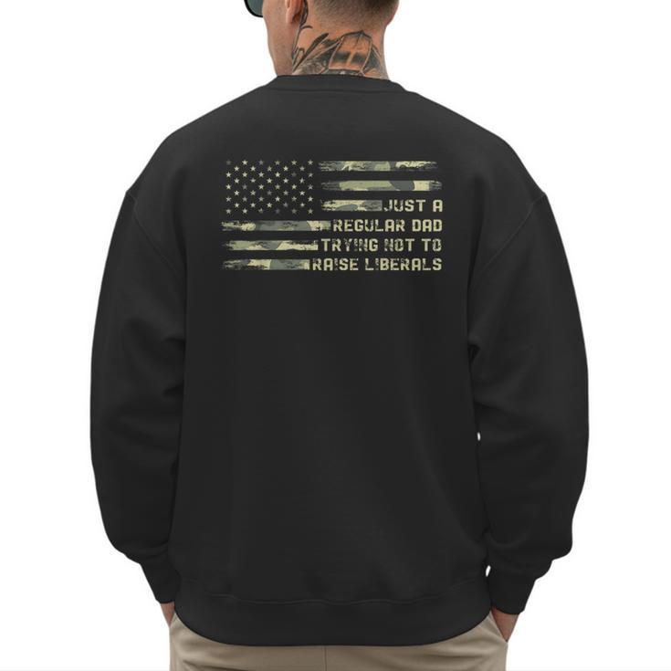 Just a Regular Dad Trying Not To Raise Liberals Camouflage Men's Sweatshirt Back Print
