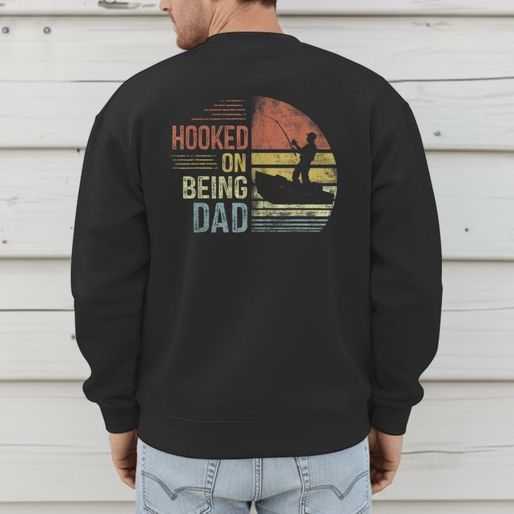 Hooked On Being Dad Fishing Dad Father's Day Men's Sweatshirt Back Print