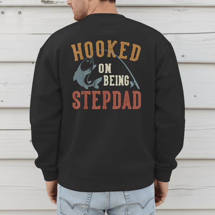 Hooked On Being Stepdad Father's Day Fishing Stepdad Men's Sweatshirt Back Print