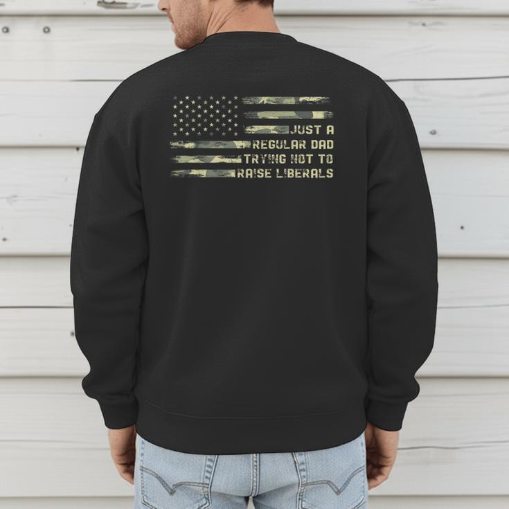 Just a Regular Dad Trying Not To Raise Liberals Camouflage Men's Sweatshirt Back Print
