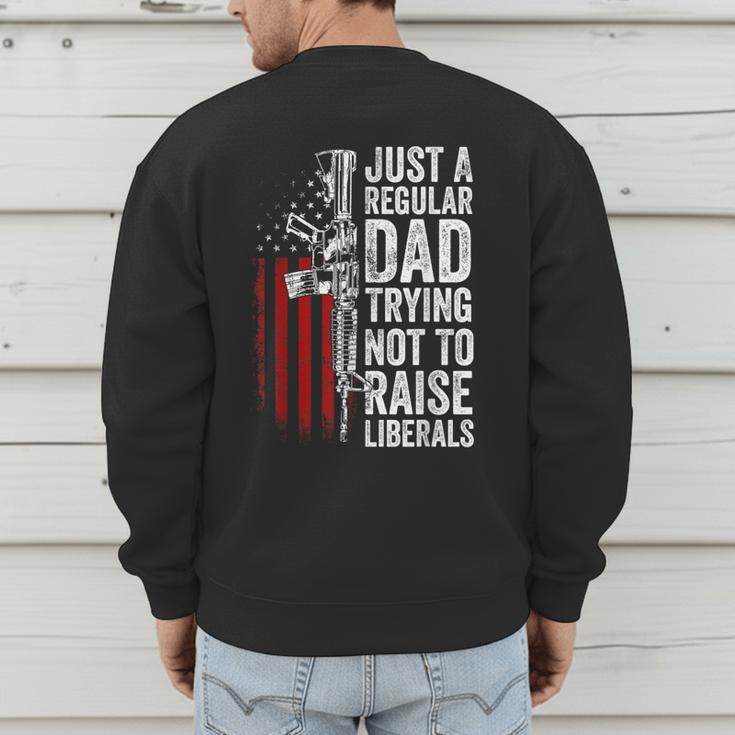 Just A Regular Dad Trying Not To Raise Liberals Father's Day Men's Sweatshirt Back Print