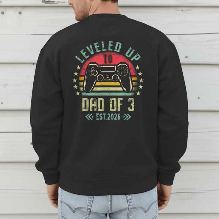 I Leveled Up To Dad Of 3 2026 Promoted To Dad Of Three Kids Men's Sweatshirt Back Print