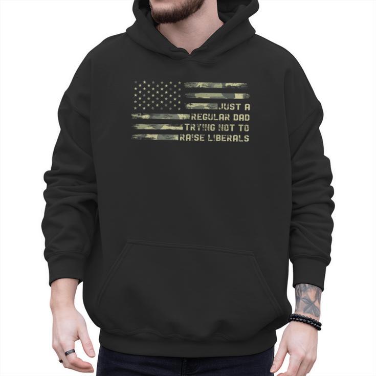 Just a Regular Dad Trying Not To Raise Liberals Camouflage Men Hoodie