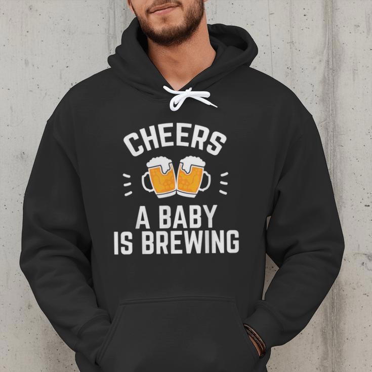 New Dad Baby Shower Cheers A Baby Is Brewing Men Hoodie New Dad Baby Shower Cheers A Baby Is Brewing Men Hoodie