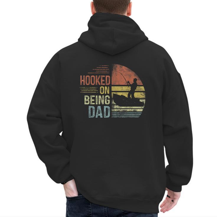 Hooked On Being Dad Fishing Dad Father's Day Men's Hoodie Back Print