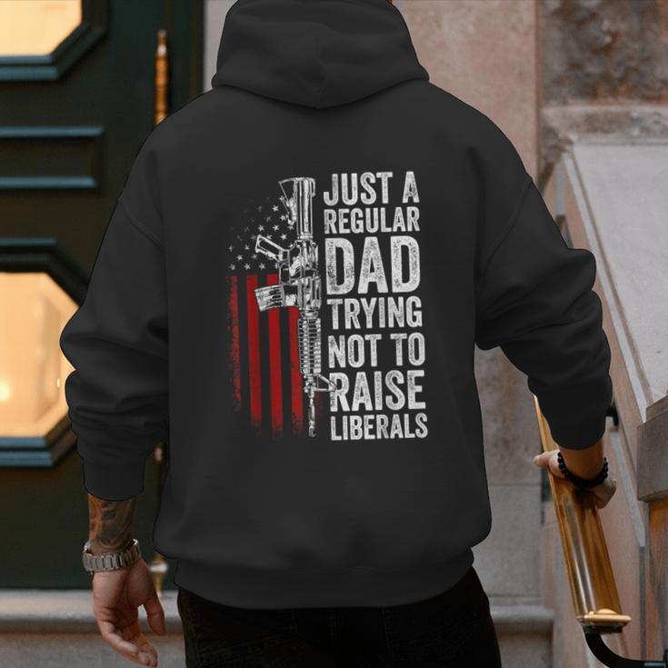 Just A Regular Dad Trying Not To Raise Liberals Father's Day Men's Hoodie Back Print