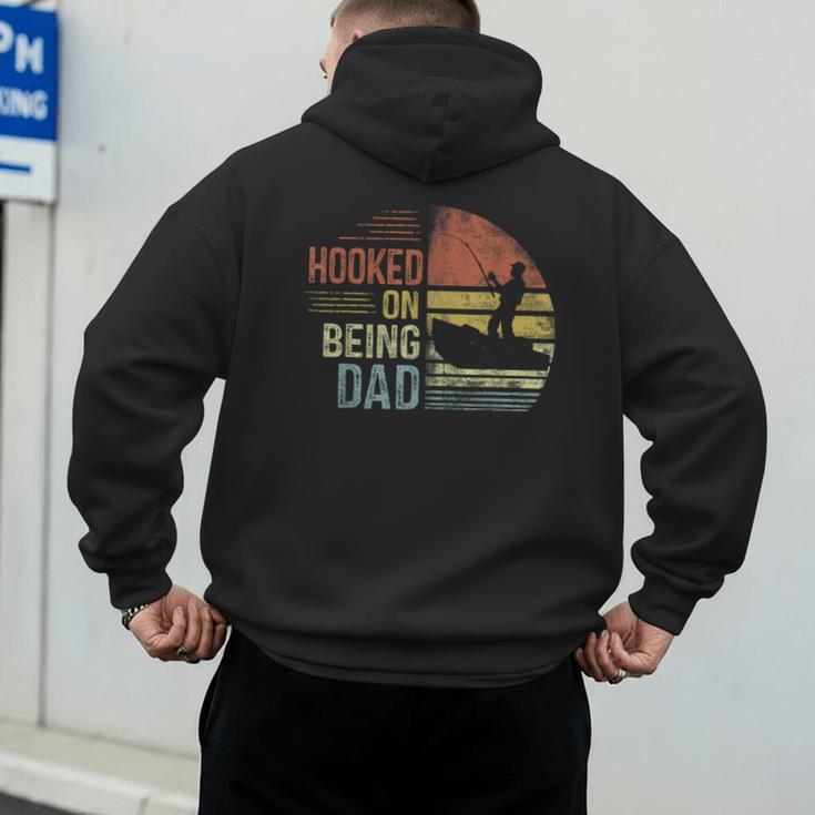 Hooked On Being Dad Fishing Dad Father's Day Men's Hoodie Back Print