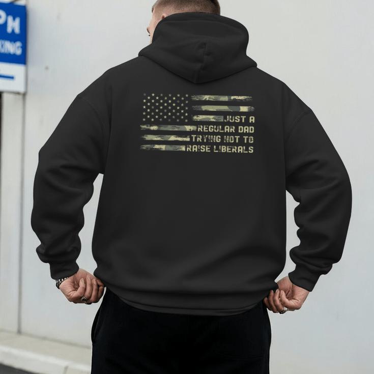 Just a Regular Dad Trying Not To Raise Liberals Camouflage Men's Hoodie Back Print