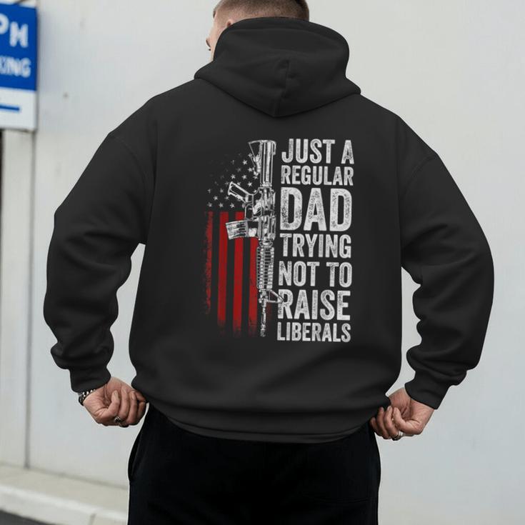 Just A Regular Dad Trying Not To Raise Liberals Father's Day Men's Hoodie Back Print