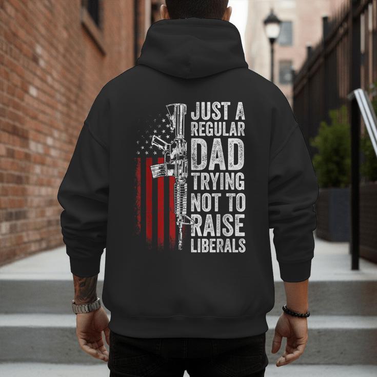 Just A Regular Dad Trying Not To Raise Liberals Father's Day Men's Hoodie Back Print