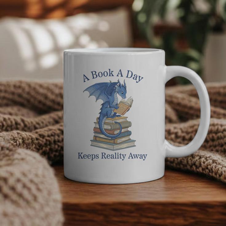 A Book A Day Keeps Reality Away Premium Tri-Blend Graphic Print Coffee Mug