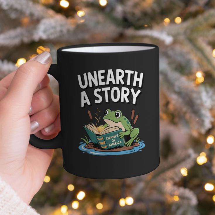 Unearth a Story Frog Reading a Book Summer 2026 Graphic Print Coffee Mug Unearth a Story Frog Reading a Book Summer 2026 Graphic Print Coffee Mug