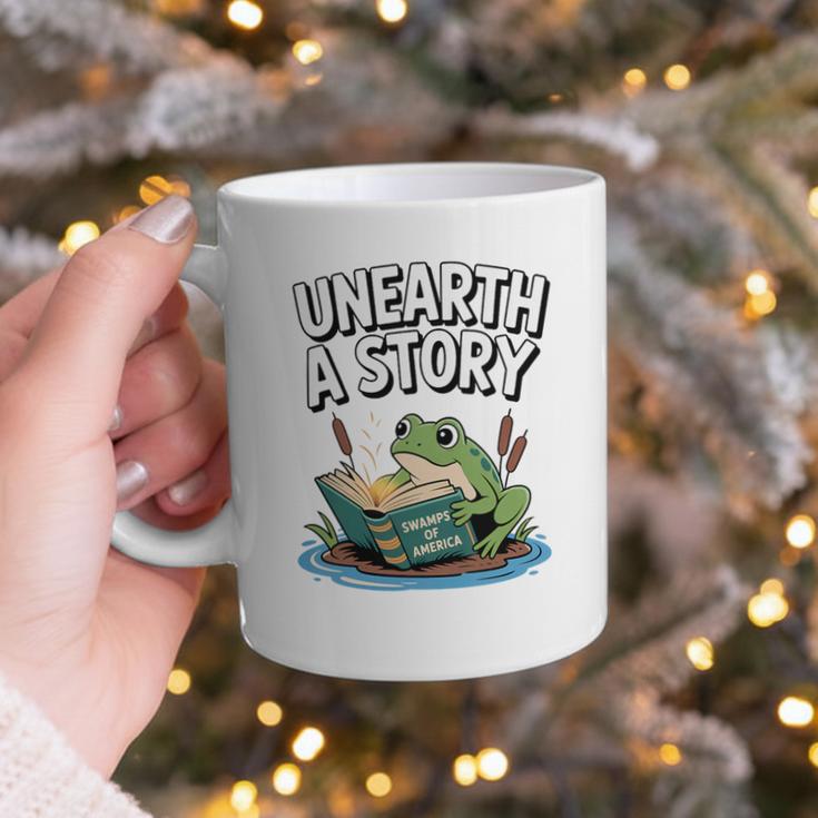 Unearth a Story Frog Reading a Book Summer 2026 Premium Tri-Blend Graphic Print Coffee Mug