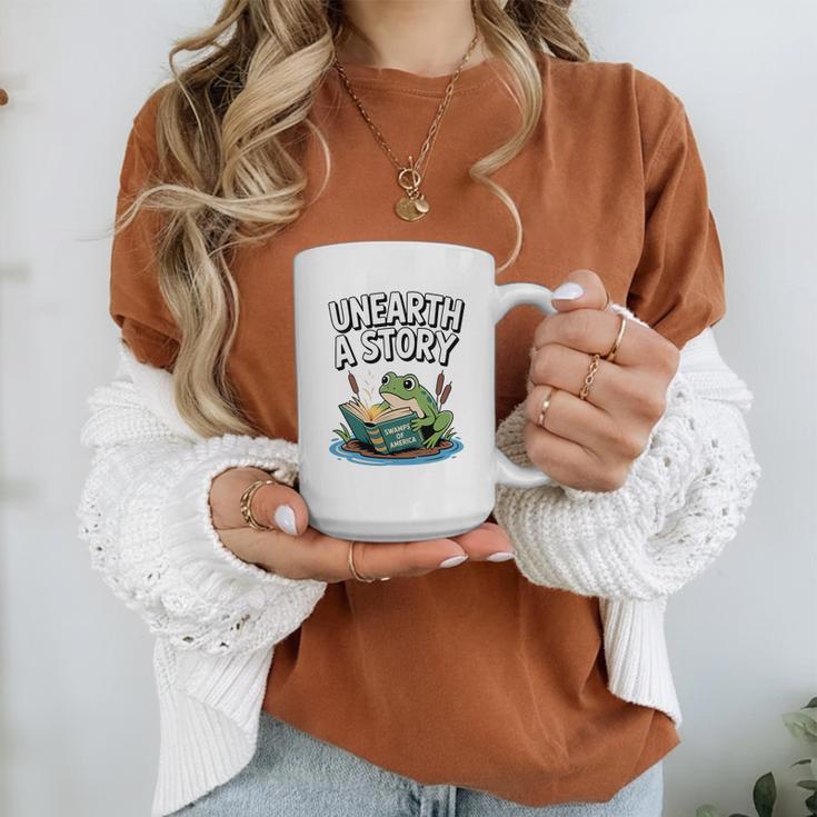 Unearth a Story Frog Reading a Book Summer 2026 Premium Tri-Blend Graphic Print Coffee Mug