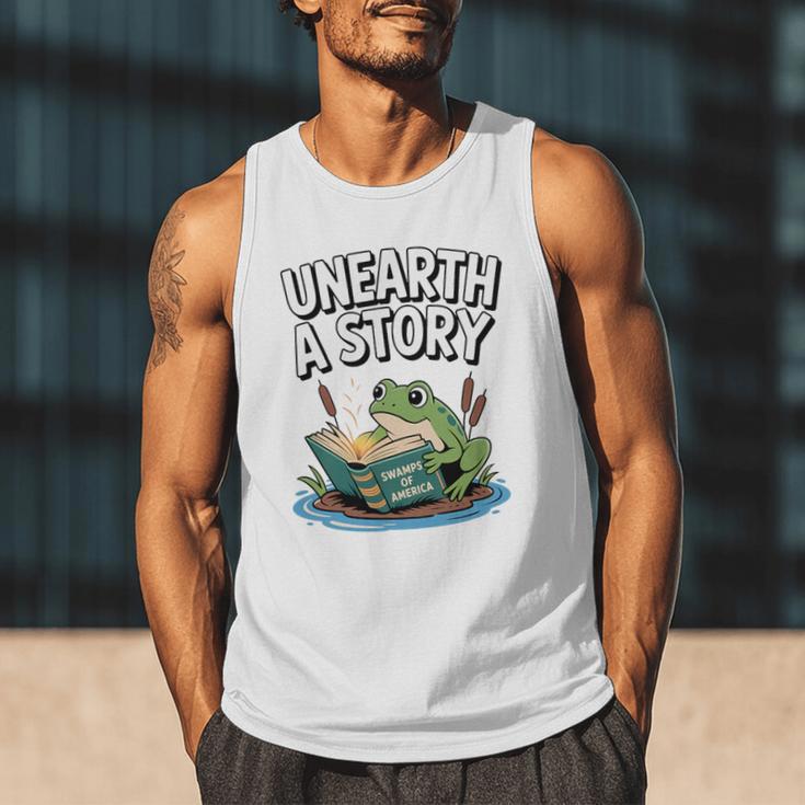 Unearth a Story Frog Reading a Book Summer 2026 Premium Tri-Blend Men Tank Top