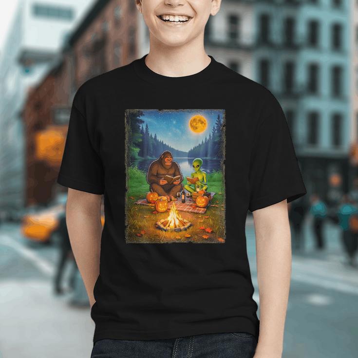 Bigfoot And Alien Reading Books Campfire Halloween Graphic Youth