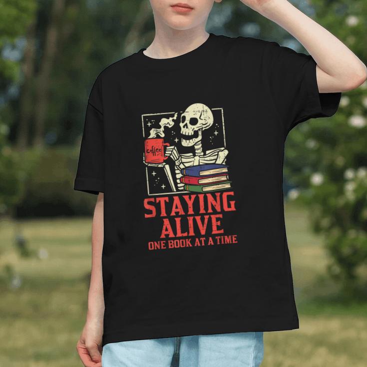 Staying Alive One Book At A Time Skeleton Reading Librarian Graphic Youth Staying Alive One Book At A Time Skeleton Reading Librarian Graphic Youth