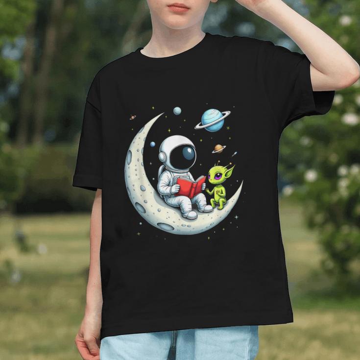 UFO Alien Astronaut Reading Book In Space Graphic Youth