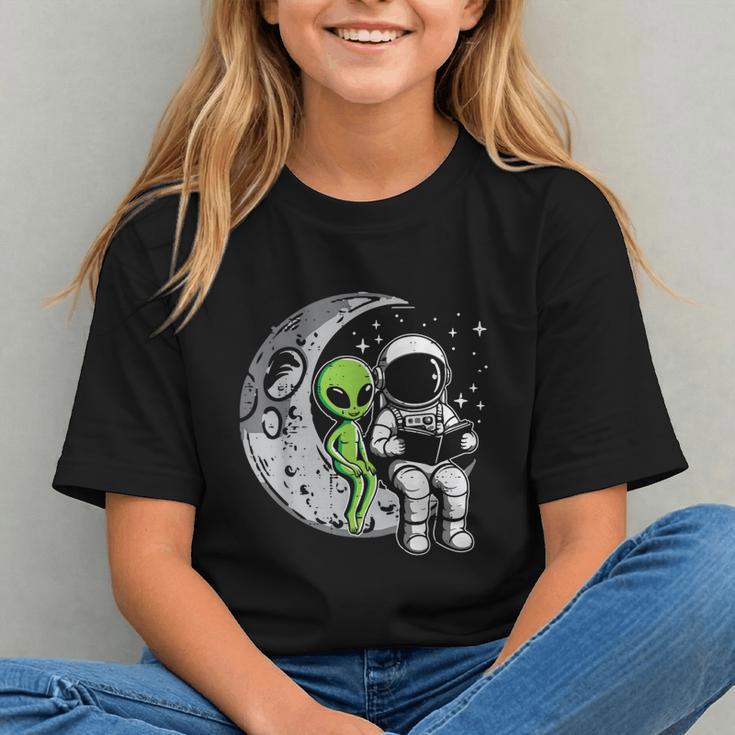Astronaut Reading Book To Alien Moon Space Women Kids Men Graphic Youth