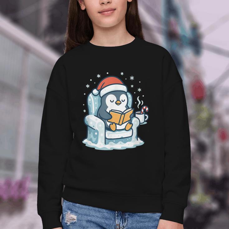 Cute Christmas Penguin Reading Book Cozy Winter Holiday Art Youth Crewneck Sweatshirt