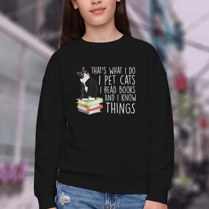 That's What I Do I Pet Cat I Read Books Tuxedo Cat Bookworm Youth Crewneck Sweatshirt That's What I Do I Pet Cat I Read Books Tuxedo Cat Bookworm Youth Crewneck Sweatshirt