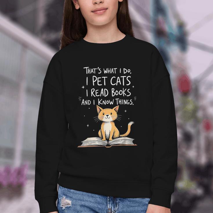 That's What I Do I Pet Cats I Read Books And I Know Things Youth Crewneck Sweatshirt
