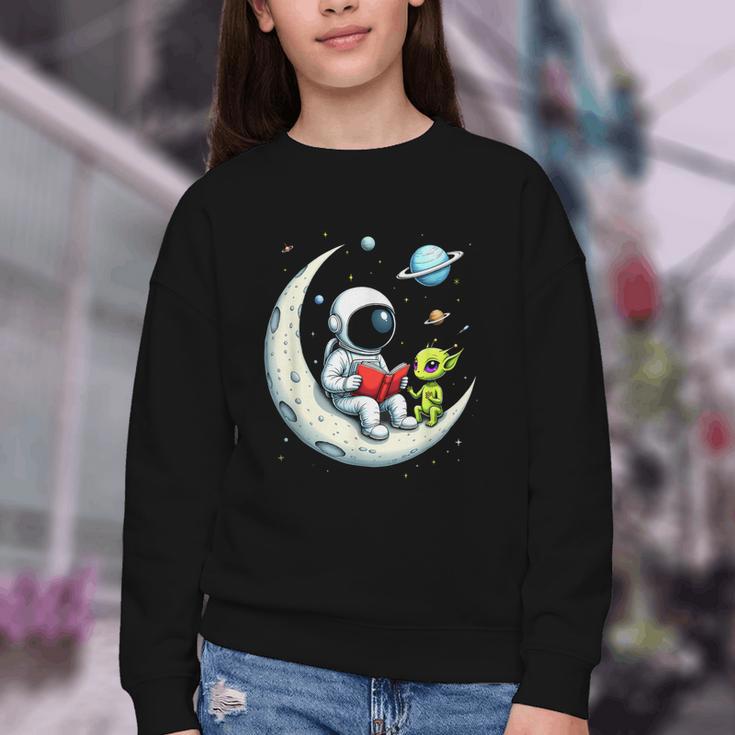 UFO Alien Astronaut Reading Book In Space Youth Crewneck Sweatshirt