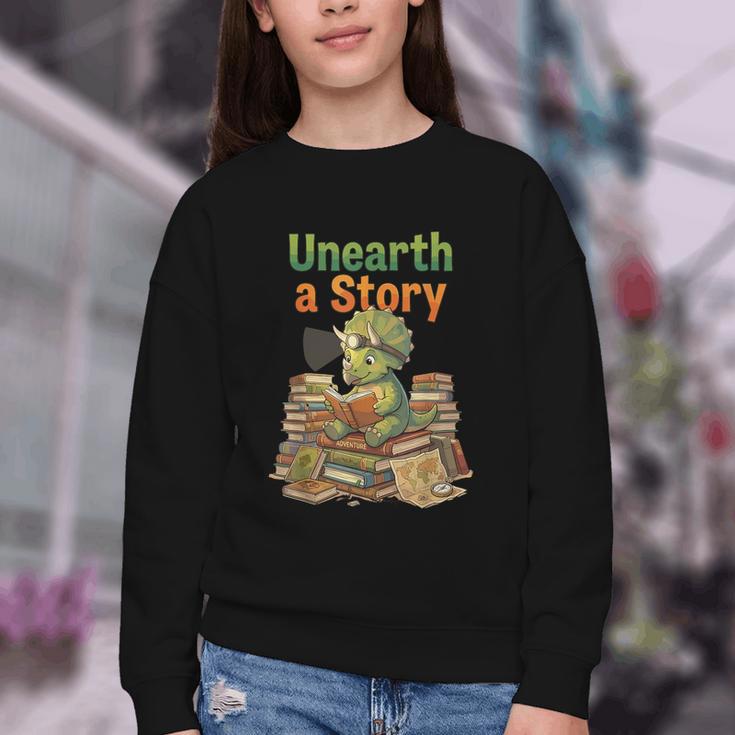 Unearth a Story Triceratops Dinosaur Reading Books Cute Dino Youth Crewneck Sweatshirt Unearth a Story Triceratops Dinosaur Reading Books Cute Dino Youth Crewneck Sweatshirt