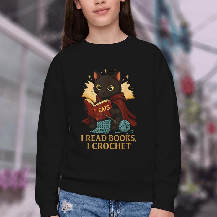 Wizard Cat Reading a Book While Crocheting Youth Crewneck Sweatshirt