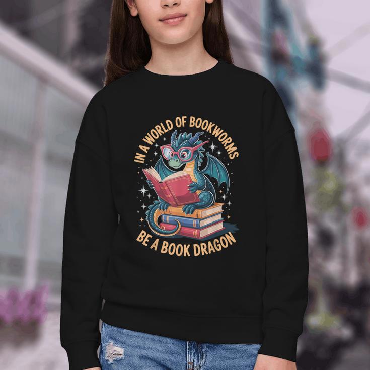 In A World Of Bookworms Be A Book Dragon Youth Crewneck Sweatshirt In A World Of Bookworms Be A Book Dragon Youth Crewneck Sweatshirt