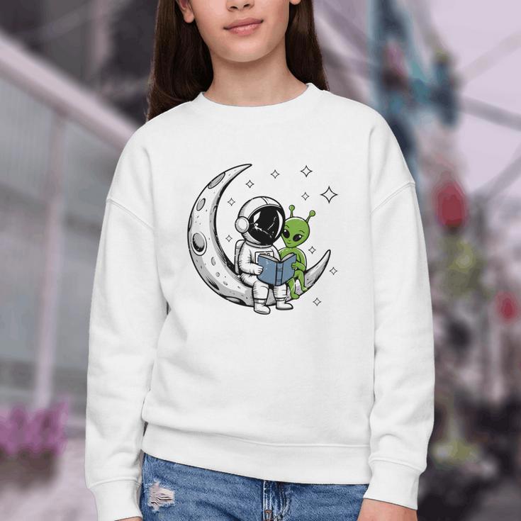 Astronaut Reading Book To Alien Moon Space Astronomy Youth Crewneck Sweatshirt