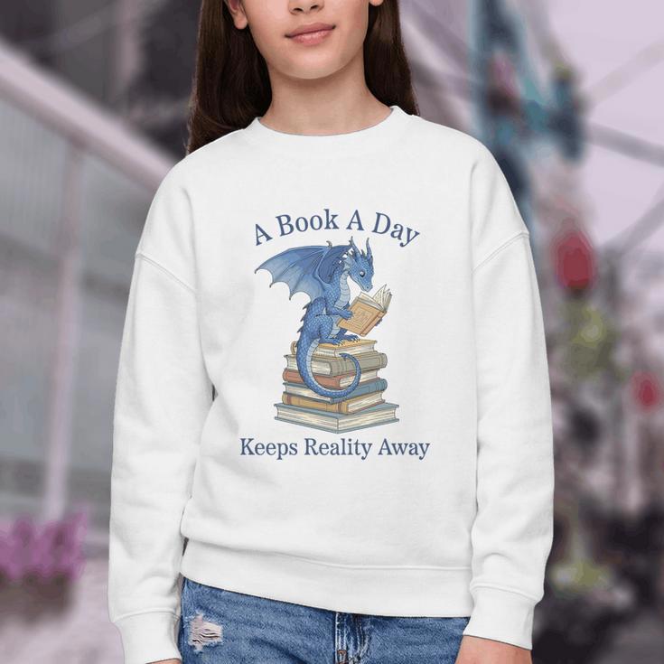 A Book A Day Keeps Reality Away Premium Tri-Blend Youth Crewneck Sweatshirt