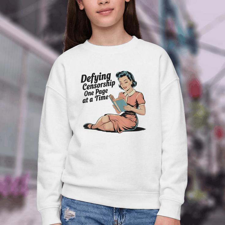 Defying Censorship One Page At a Time Read Banned Books Youth Crewneck Sweatshirt Defying Censorship One Page At a Time Read Banned Books Youth Crewneck Sweatshirt