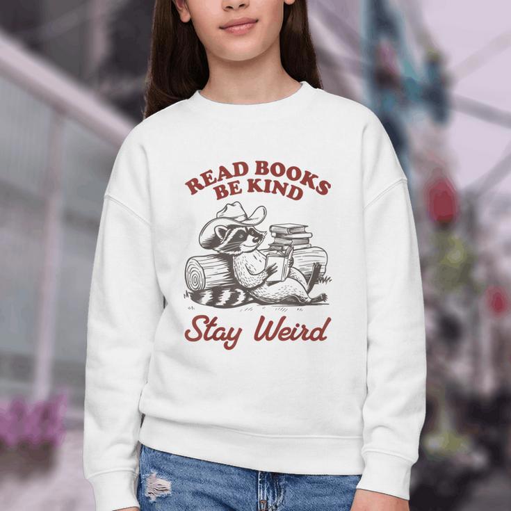 Read Books Be Kind Stay Weird Bookish Cowboy Reading Raccoon Youth Crewneck Sweatshirt
