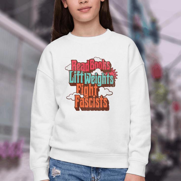 Read Books Lift Weights Fight Fascists Reading No Kings Premium Tri-Blend Youth Crewneck Sweatshirt