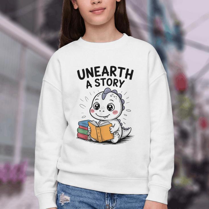 Unearth a Story Cute Dinosaur Summer Reading 2026 Dino Book Youth Crewneck Sweatshirt Unearth a Story Cute Dinosaur Summer Reading 2026 Dino Book Youth Crewneck Sweatshirt