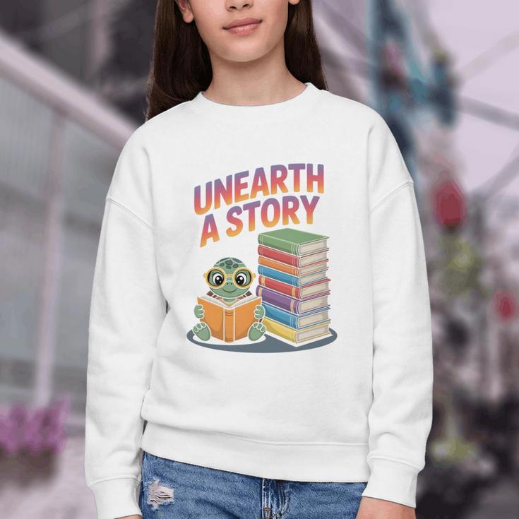 Unearth A Story Cute Turtle Reading Books Librarian Youth Crewneck Sweatshirt