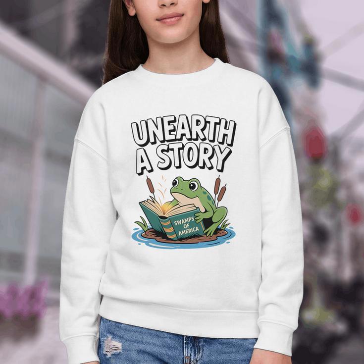 Unearth a Story Frog Reading a Book Summer 2026 Premium Tri-Blend Youth Crewneck Sweatshirt
