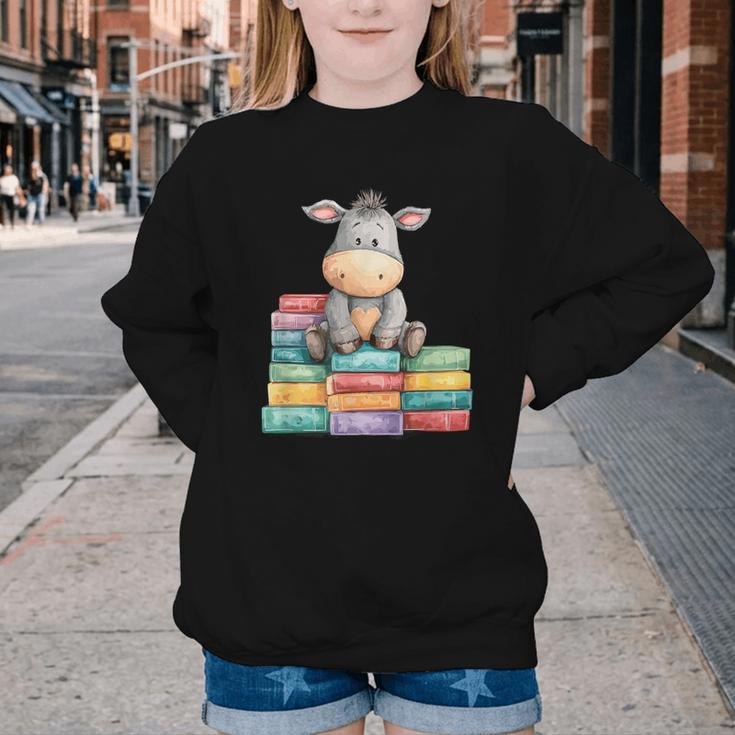 Adorable Donkey With Heart Sitting On Colorful Book Stack Youth Crewneck Sweatshirt