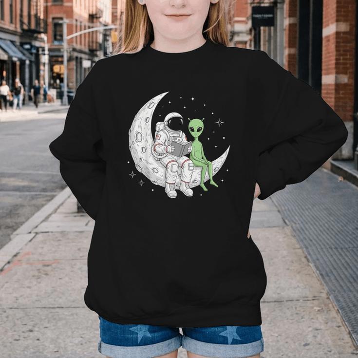 Astronaut Reading Book To Alien Moon Space Book Lover Men Youth Crewneck Sweatshirt