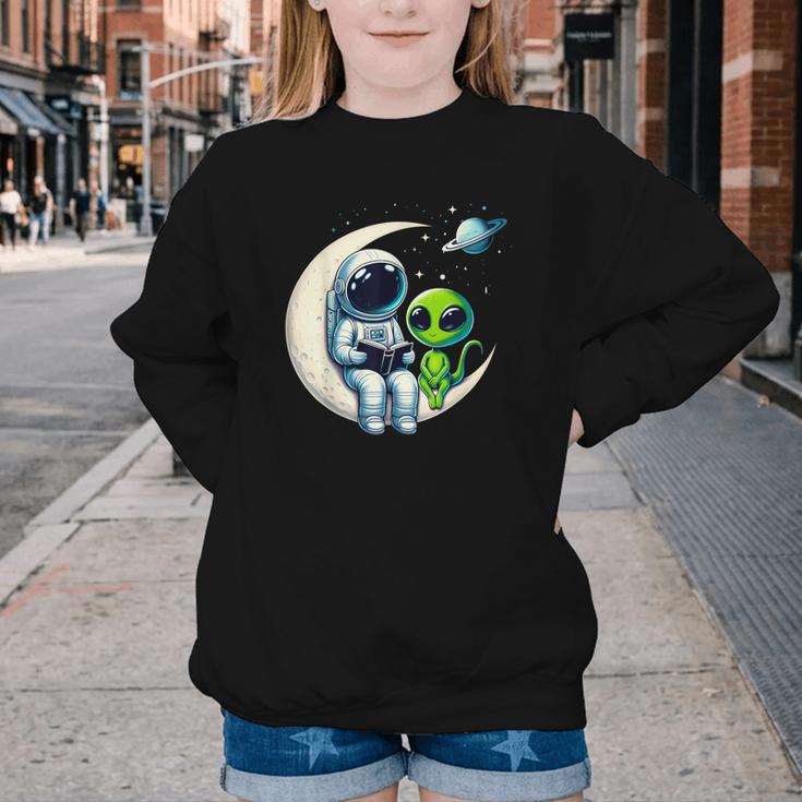 Astronaut Reading Book To Alien Shirt Moon Space Lover Kids Youth Crewneck Sweatshirt