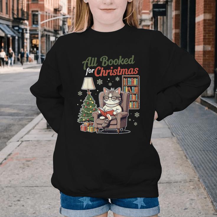 All Booked For Christmas Cute Bookish Cat Lover Youth Crewneck Sweatshirt