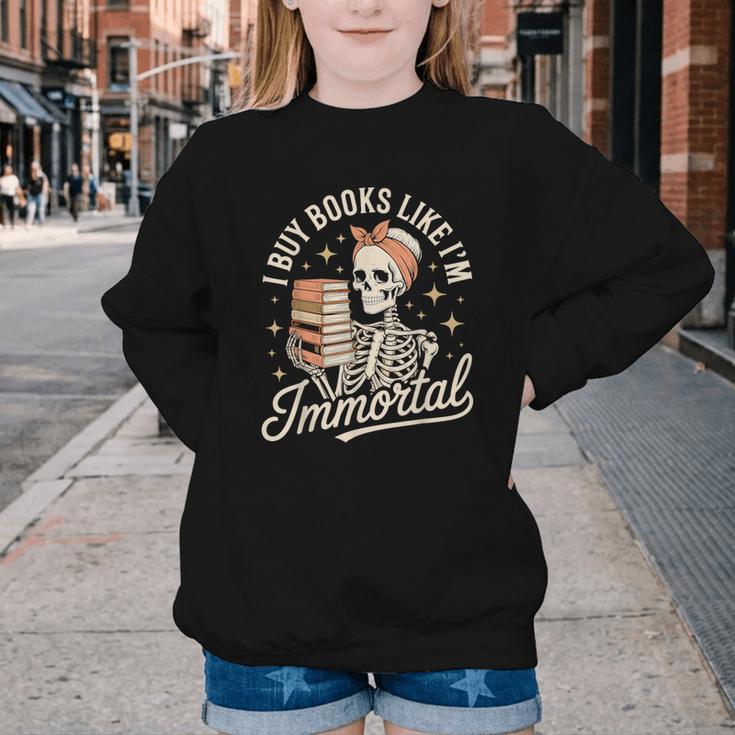 I Buy Books Like I'm Immortal Reading Book Lover Skeleton Youth Crewneck Sweatshirt I Buy Books Like I'm Immortal Reading Book Lover Skeleton Youth Crewneck Sweatshirt