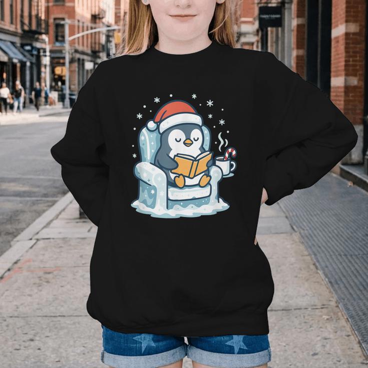 Cute Christmas Penguin Reading Book Cozy Winter Holiday Art Youth Crewneck Sweatshirt