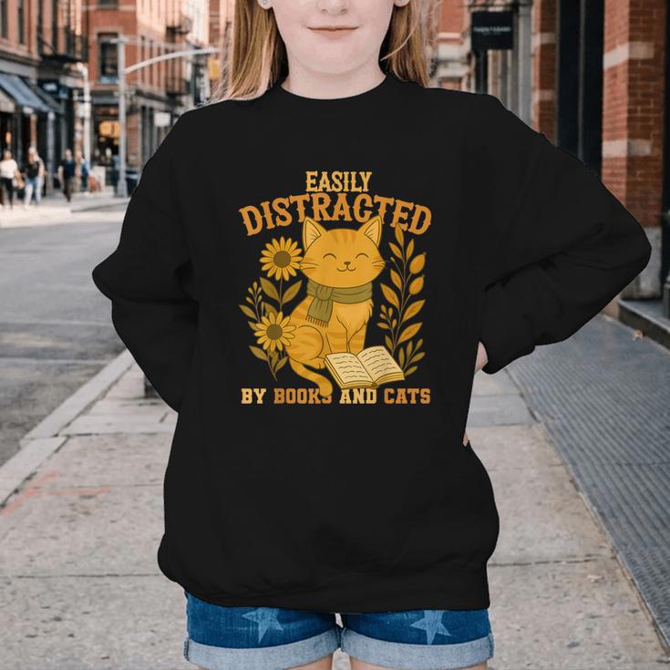Easily Distracted By Cats And Books Cute Cat Book Lover Youth Crewneck Sweatshirt